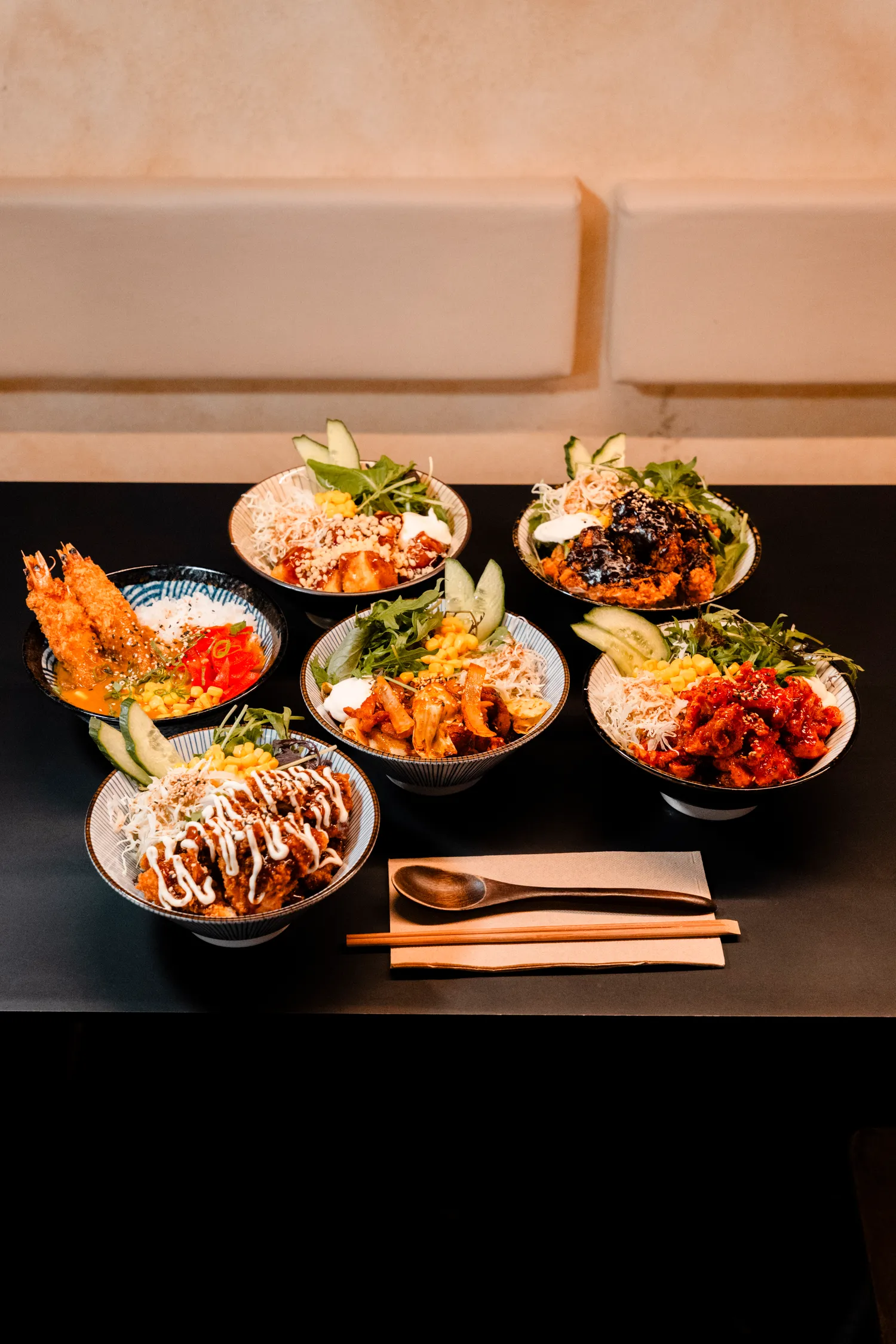 An overhead spread of WATDA's Korean lunch bowls