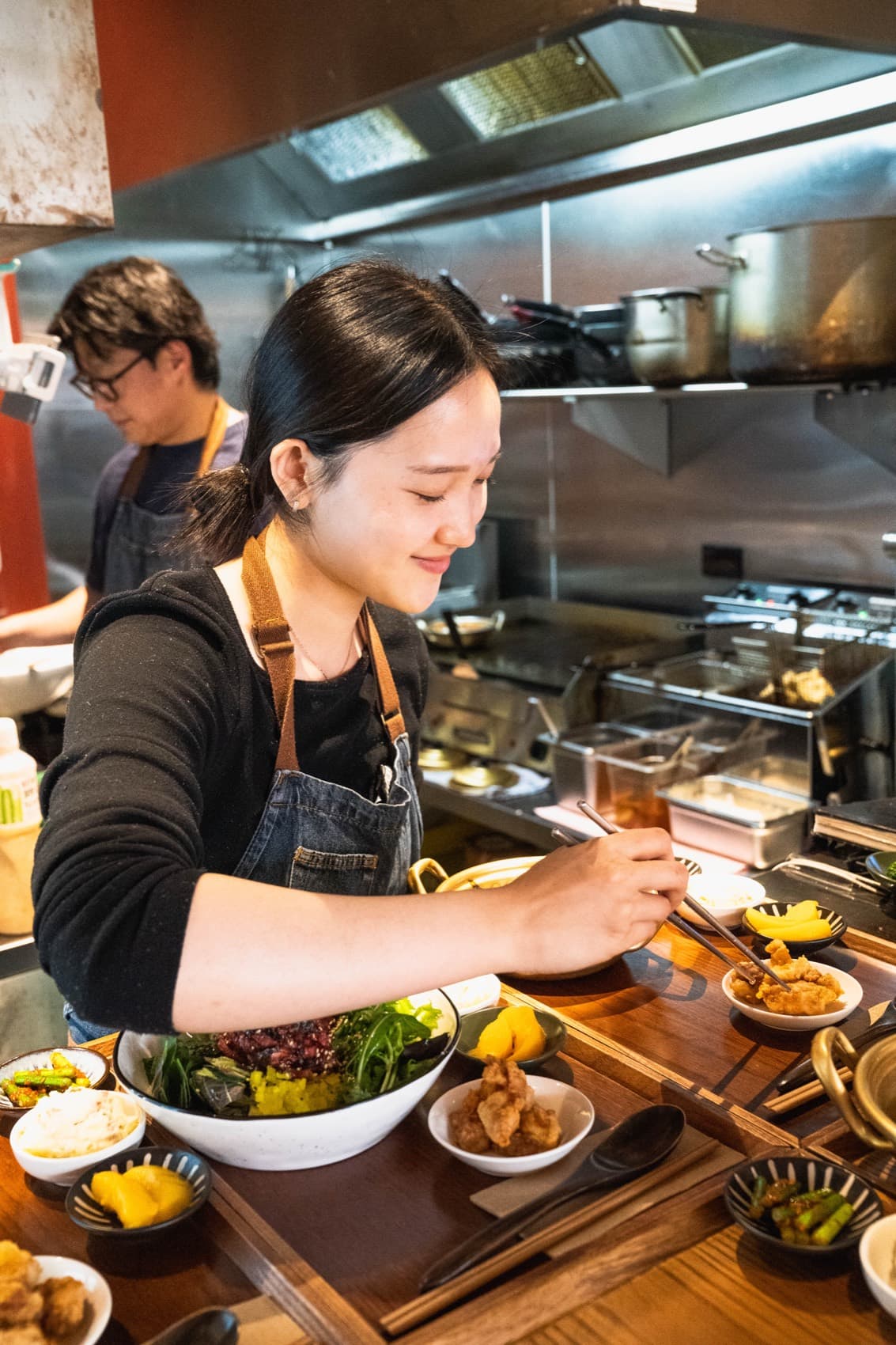 WATDA's team plating dishes in the kitchen